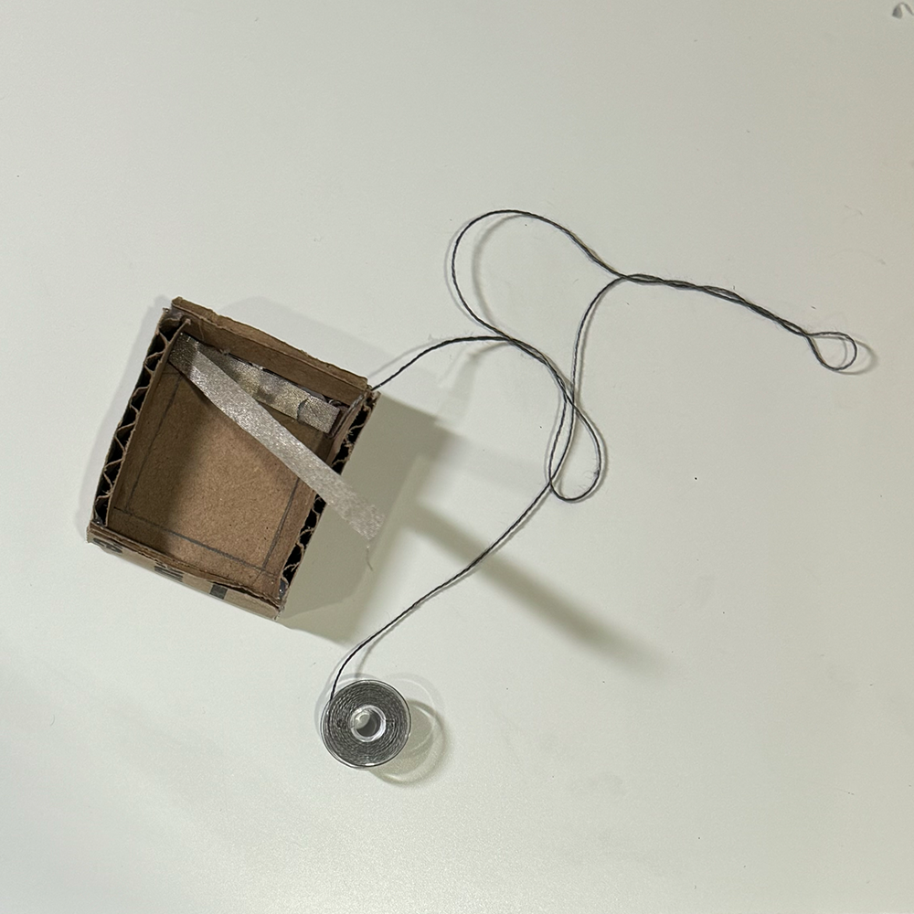 This is a picture of a top view of the shell that would hold the spring and keycap. This was also my first experiement trying to see if the conductive fabric would work.