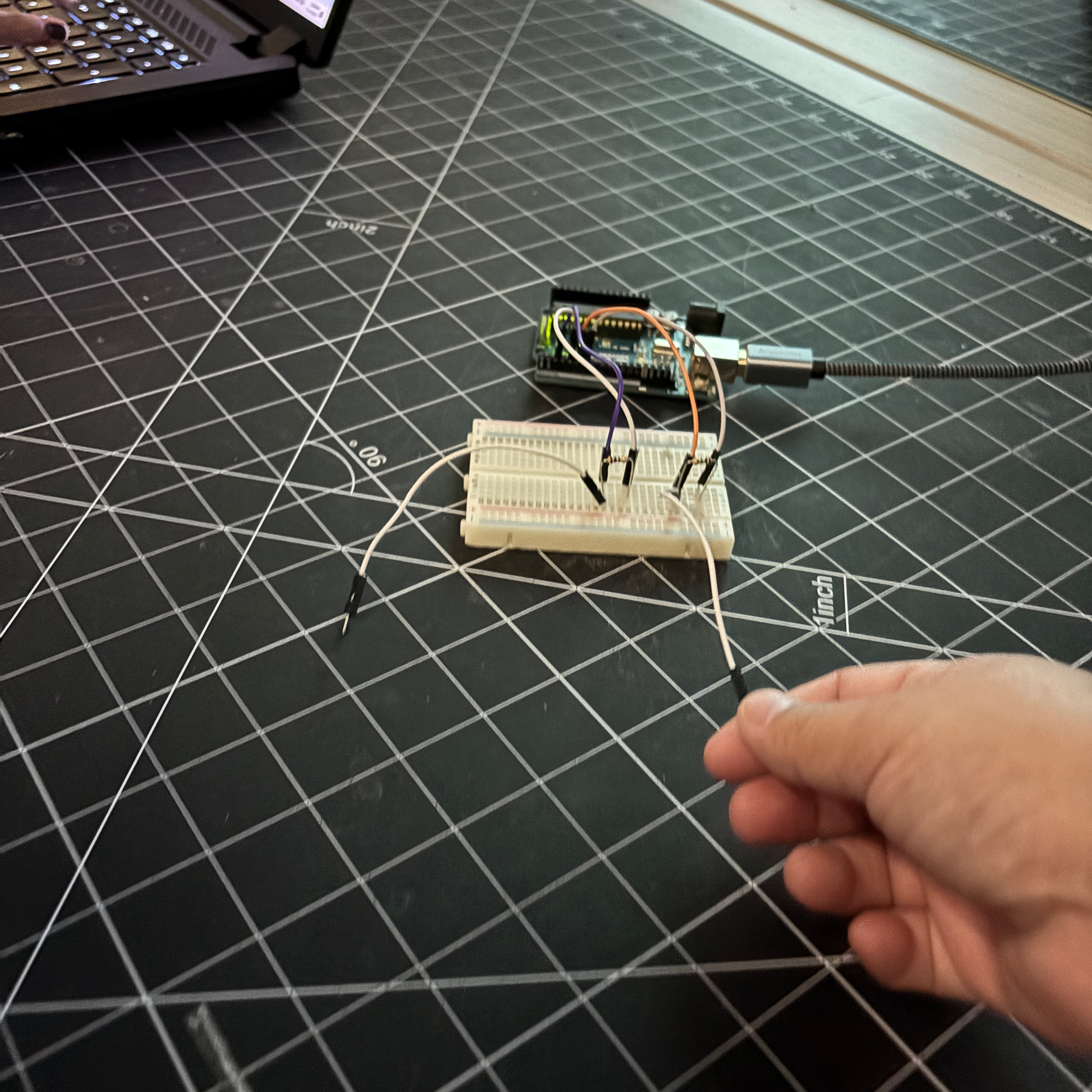This is an image of me testing how the capacitive touch sesnor works. When I touched the exposed wire the 0 would change to 1 in the serial monitor.