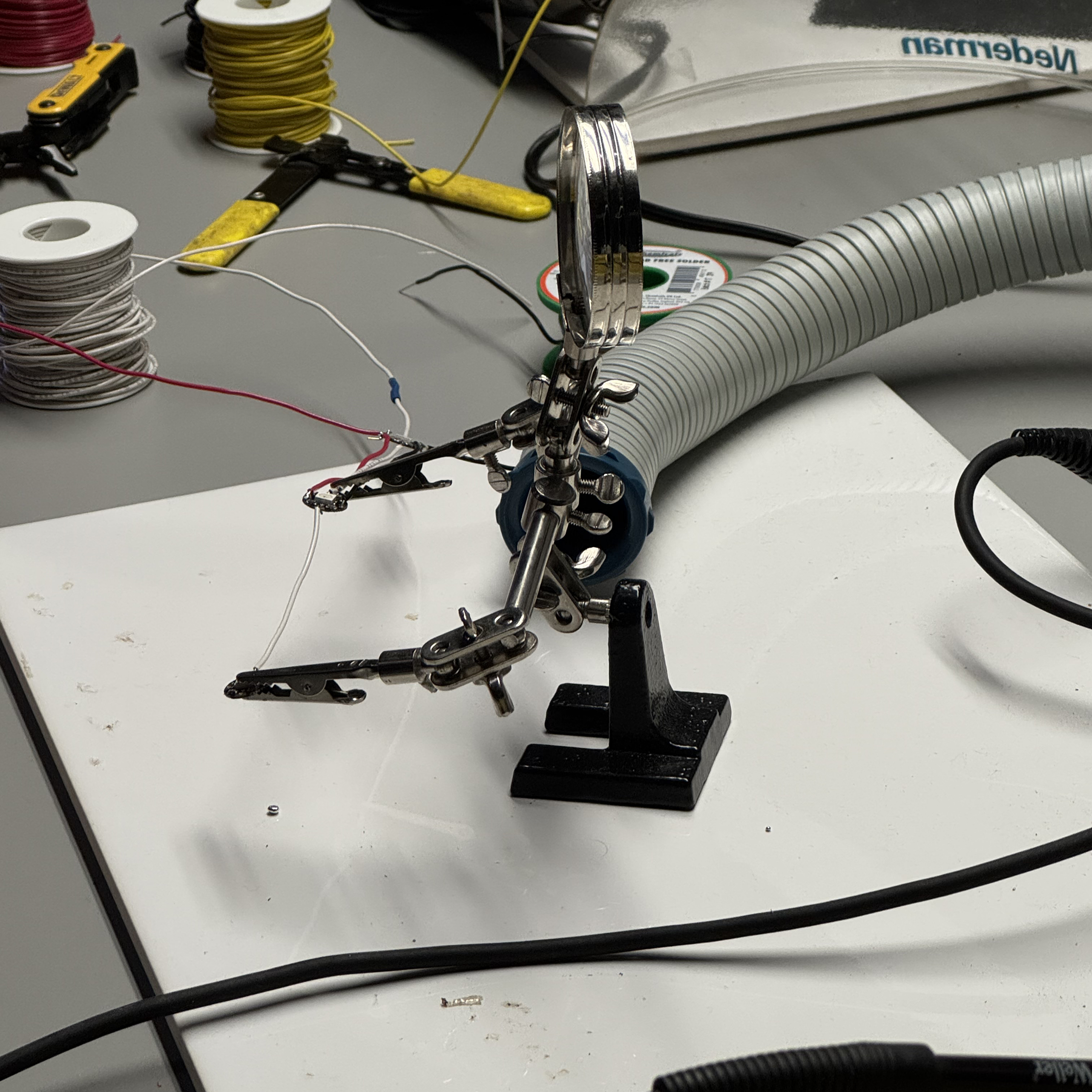 To ensure a steady work area while soldering it is important to utilize the helping hand tool to hold your components in place.