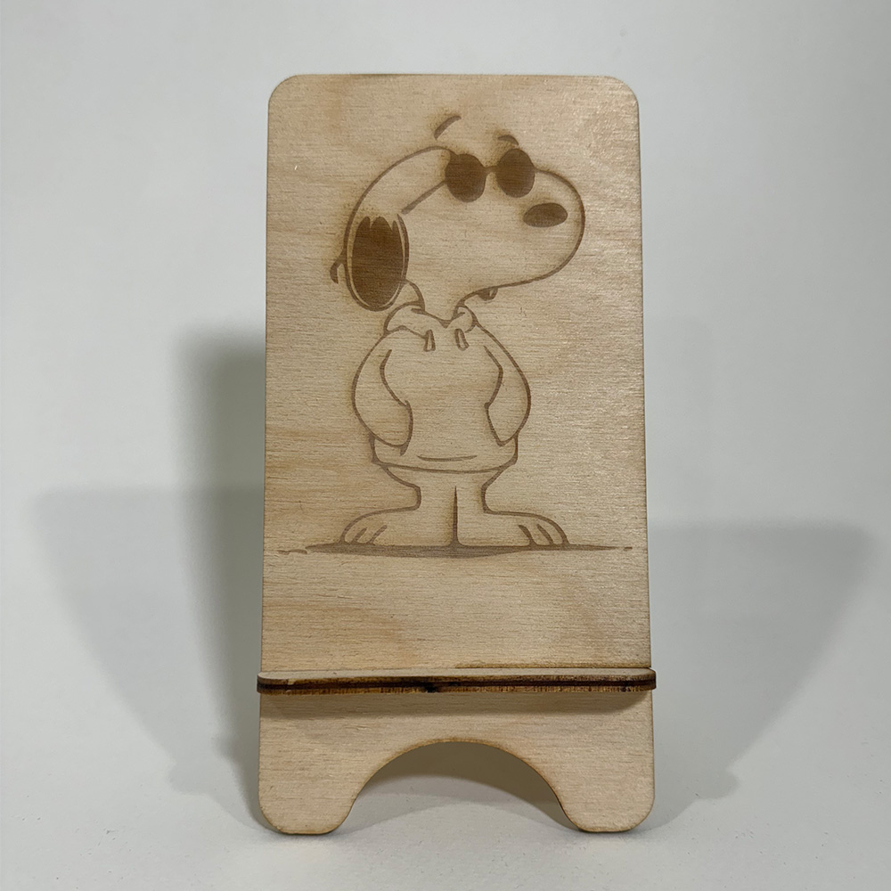Laser cut wooden phone stand.